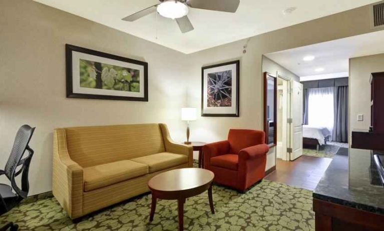 Spacious living room in a king guestroom at the Hilton Garden Inn Fort Collins.