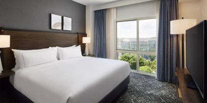 Comfortable king size bed on executive floor at the Hilton Charlotte Airport