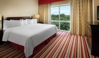 Comfortable king size bed at the Hilton Charlotte Airport