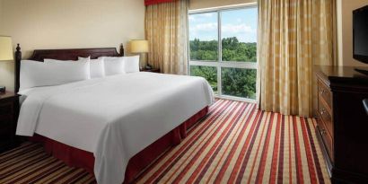 Comfortable king size bed at the Hilton Charlotte Airport