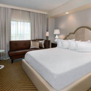 Comfortable king size bed on presidential suite at the Hilton Charlotte Airport