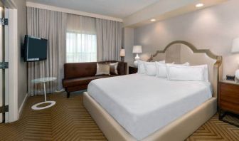 Comfortable king size bed on presidential suite at the Hilton Charlotte Airport