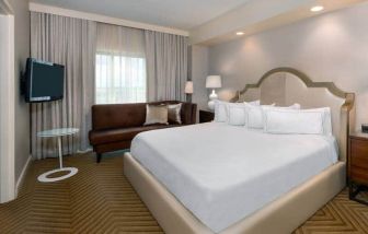 Comfortable king size bed on presidential suite at the Hilton Charlotte Airport