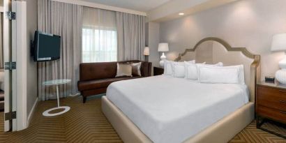 Comfortable king size bed on presidential suite at the Hilton Charlotte Airport