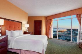 Spacious king bed room with a view, tv, activity table and bath at the Embassy Suites by Hilton Hampton Convention Center