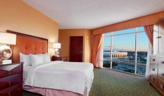 Spacious king bed room with a view, tv, activity table and bath at the Embassy Suites by Hilton Hampton Convention Center