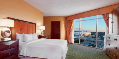 Spacious king bed room with a view, tv, activity table and bath at the Embassy Suites by Hilton Hampton Convention Center