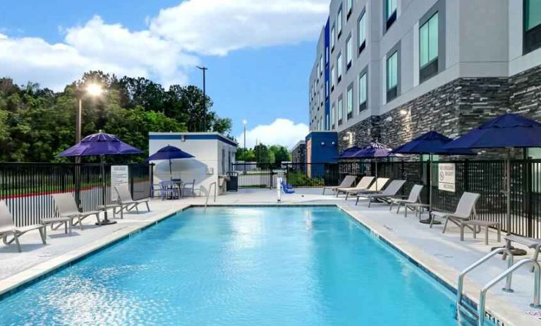 Relaxing outdoor pool area at the Hampton Inn & Suites Houston East Beltway 8.