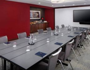 Meeting room with elongated table and chairs at the DoubleTree by Hilton Manchester Downtown