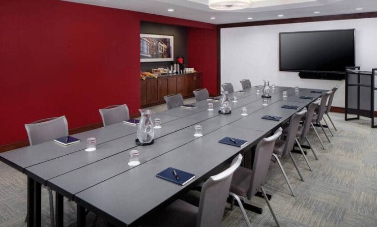 Meeting room with elongated table and chairs at the DoubleTree by Hilton Manchester Downtown