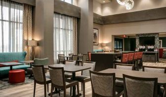 Well-lit, spacious lounge and work area for coworking at Hampton Inn Wichita Northwest.