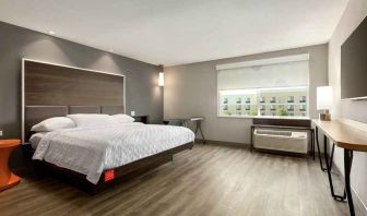 spacious delux king bed with natural light at Tru by Hilton Wichita Northeast.