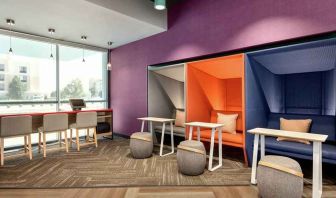 comfortable working space with natural light at Tru by Hilton Wichita Northeast.