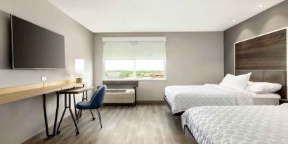 2 queen beds in spacious room with mobile work desk at Tru by Hilton Wichita Northeast.