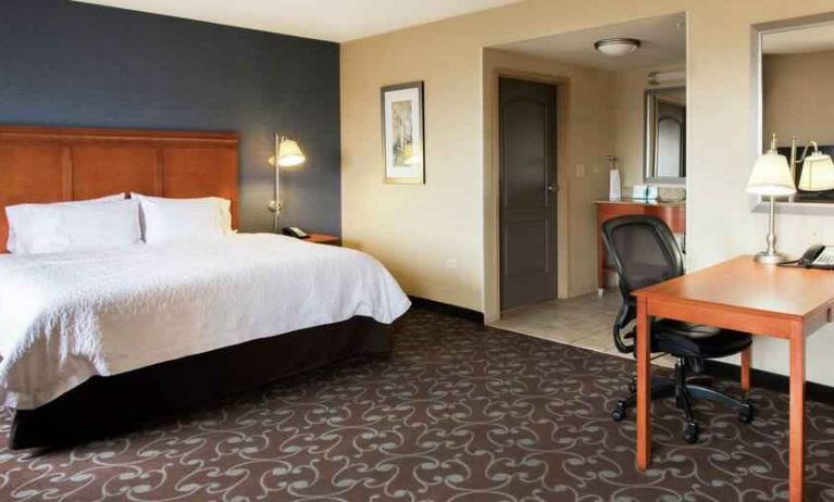 Spacious studio with 1 king size bed and working station at the Hampton Inn & Suites Chicago Deer Park.