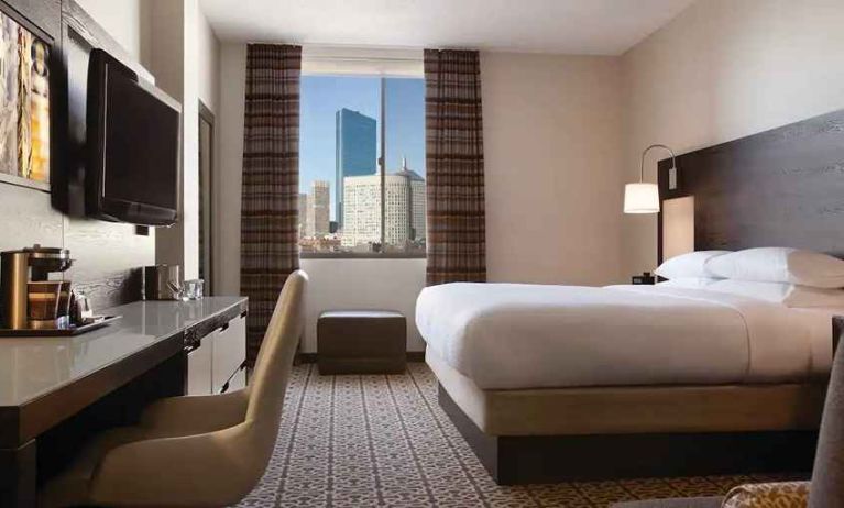 luxurious king bed with city view at DoubleTree by Hilton Hotel Boston - Downtown.