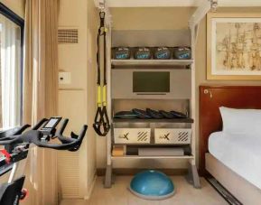 Guestroom with fitness equipment at the Hilton Denver City Center.