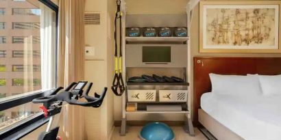 Guestroom with fitness equipment at the Hilton Denver City Center.