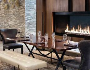 Elegant and comfortable fireside dining area perfect as workspace at the Hilton Denver City Center.