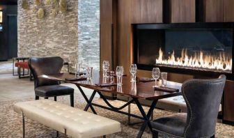 Elegant and comfortable fireside dining area perfect as workspace at the Hilton Denver City Center.