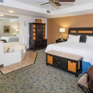 Beautiful suite with king size bed, whirlpool and desk at the Hampton Inn & Suites Amelia Island-Historic Harbor Front.