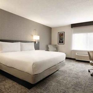 Cozy king bedroom with work desk at Hilton Garden Inn Washington DC Downtown.