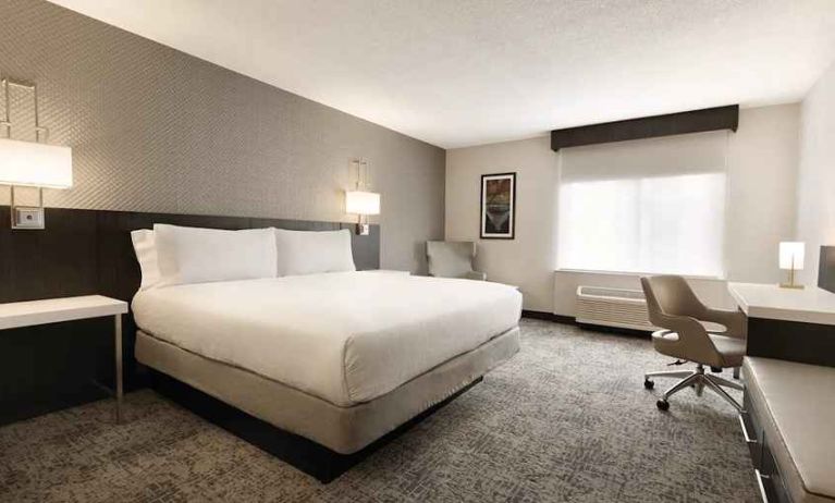 Cozy king bedroom with work desk at Hilton Garden Inn Washington DC Downtown.