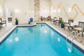 relaxing indoor pool with seating at Hilton Garden Inn Washington DC Downtown.