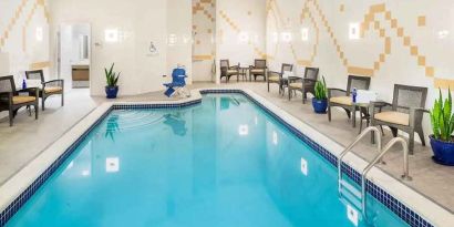 relaxing indoor pool with seating at Hilton Garden Inn Washington DC Downtown.