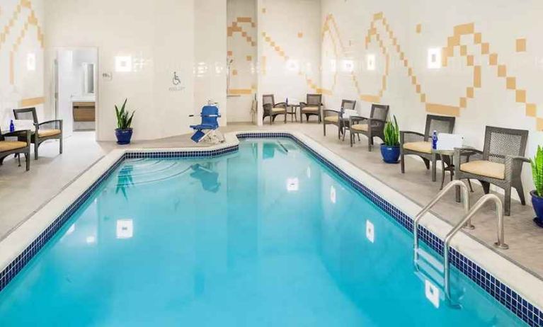 relaxing indoor pool with seating at Hilton Garden Inn Washington DC Downtown.