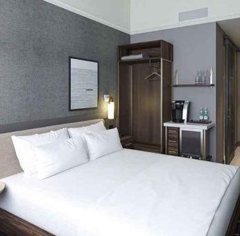 king bed with desk and all amenities at The Slate Denver, Tapestry Collection by Hilton.