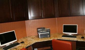 work desk with computers and printers at Hampton Inn & Suites Phoenix/Gilbert, AZ.