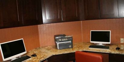 work desk with computers and printers at Hampton Inn & Suites Phoenix/Gilbert, AZ.