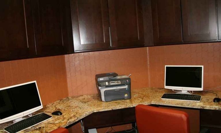 work desk with computers and printers at Hampton Inn & Suites Phoenix/Gilbert, AZ.