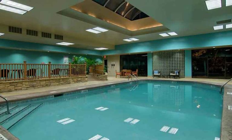 large outdoor pool with seating area at Hilton Raleigh North Hills.