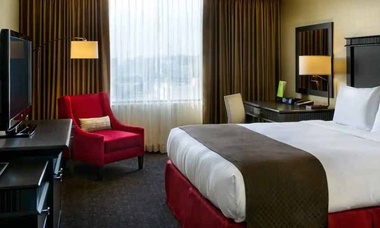 luxurious and cosy king-sized bed in beautiful well lit room at DoubleTree by Hilton Los Angeles Downtown.