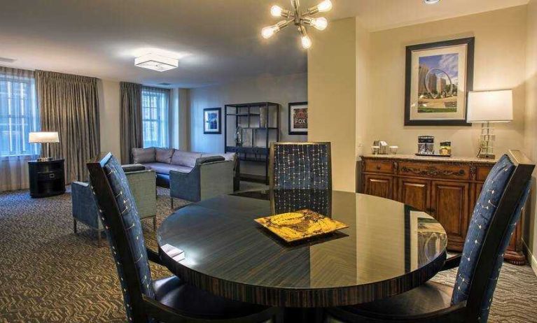 Comfortable and spacious living room with working station at the DoubleTree Suites by Hilton Detroit Downtown - Fort Shelby.