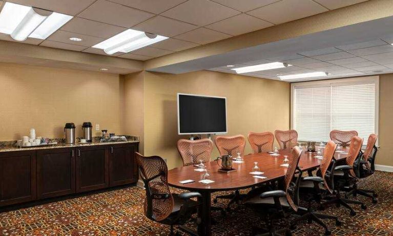 Elegant meeting room with buffet area at the DoubleTree Suites by Hilton Detroit Downtown - Fort Shelby.