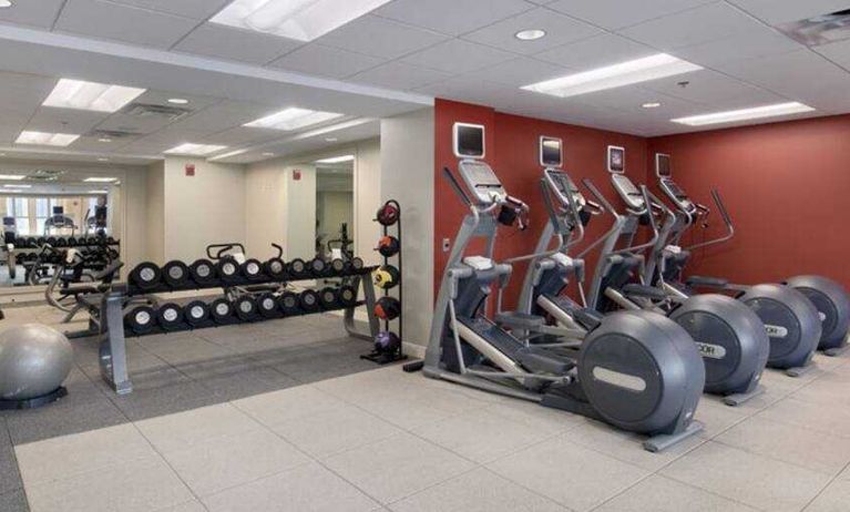 Fitness center with treadmills and weights at the DoubleTree Suites by Hilton Detroit Downtown - Fort Shelby.