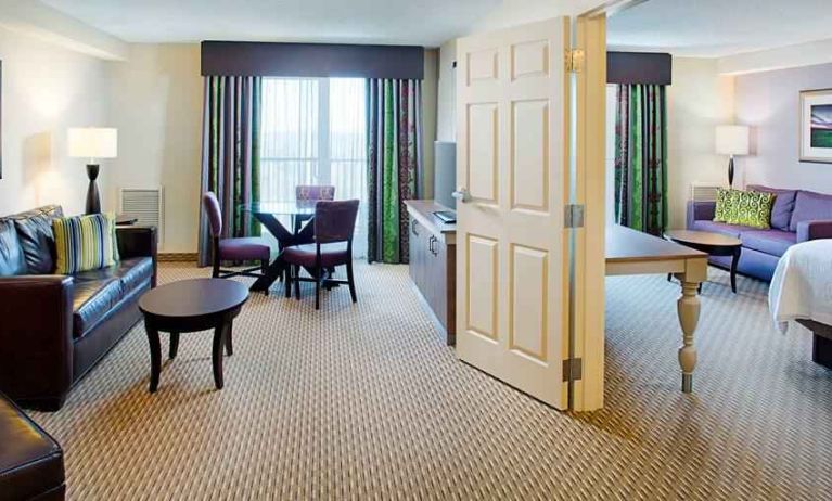 Spacious king suite with king bedroom and living room at the Hilton Garden Inn Hartford North/Bradley Intl Airport.