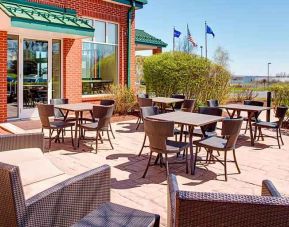 Beautiful outdoor terrace suitable as workspace at the Hilton Garden Inn Hartford North/Bradley Intl Airport.