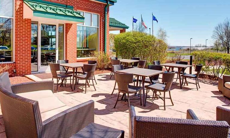 Beautiful outdoor terrace suitable as workspace at the Hilton Garden Inn Hartford North/Bradley Intl Airport.