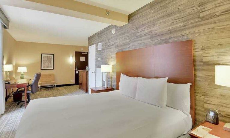 Stylish bedroom with king bed and working station at the DoubleTree Suites by Hilton Houston by the Galleria.