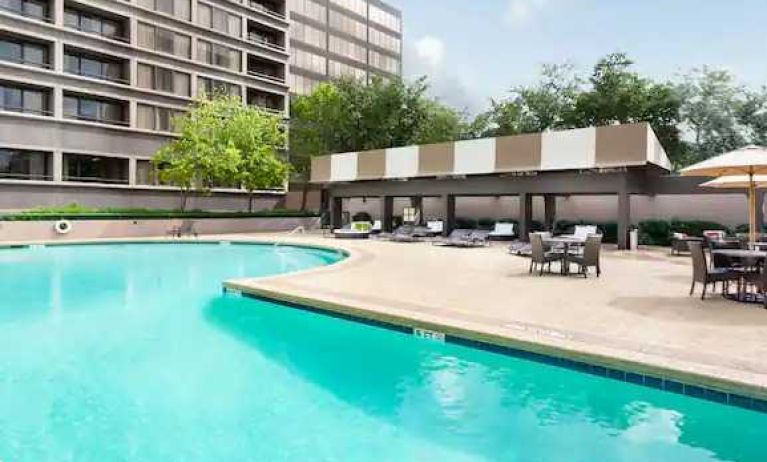 Relaxing outdoor pool area at the DoubleTree Suites by Hilton Houston by the Galleria.