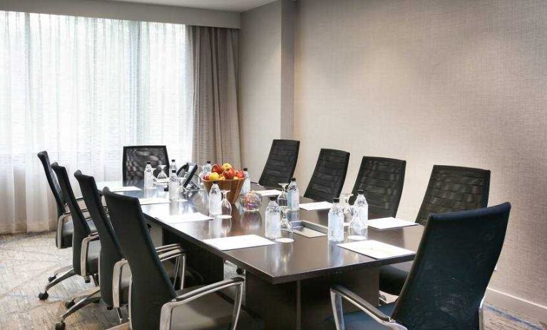 Meeting room with square conference table at the DoubleTree Suites by Hilton Houston by the Galleria.