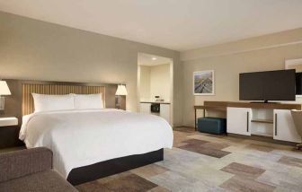 comfortable king suite with work area at Hampton Inn Salt Lake City Cottonwood.