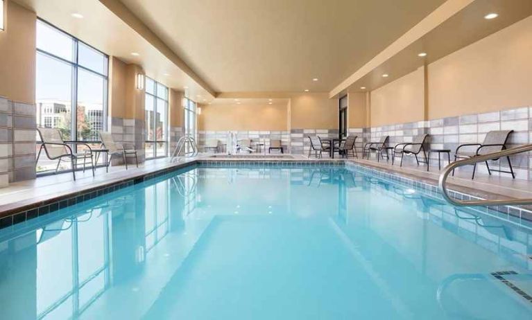 brigh-lit indoor pool with seating area at Hampton Inn Salt Lake City Cottonwood.