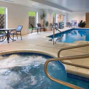 Relaxing indoor pool area with whirlpool at the Hilton Garden Inn Clarksburg.