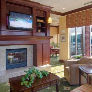 Elegant lobby area with fireplace and TV at the Hilton Garden Inn Clarksburg.