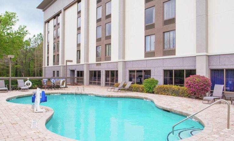 Beautiful outdoor pool area at the Hampton Inn Columbia Northeast-Fort Jackson Area, SC.